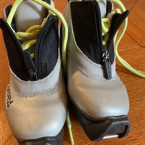 Cross country ski boots, size EU 28. Color is silver, black with lime green